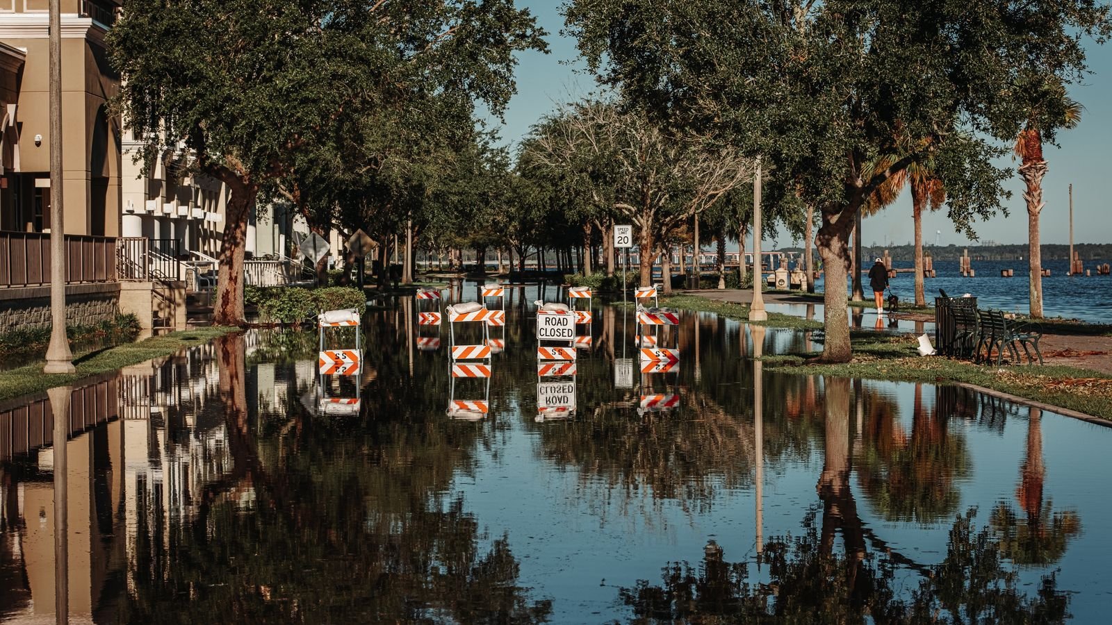 Flooded street with road closed signs after heavy rain